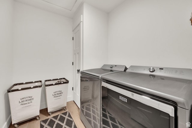 1279 S 50 E, Salem, UT 84653 - laundry room featuring washer and clothes dryer, light wood-type flooring, and baseboards
