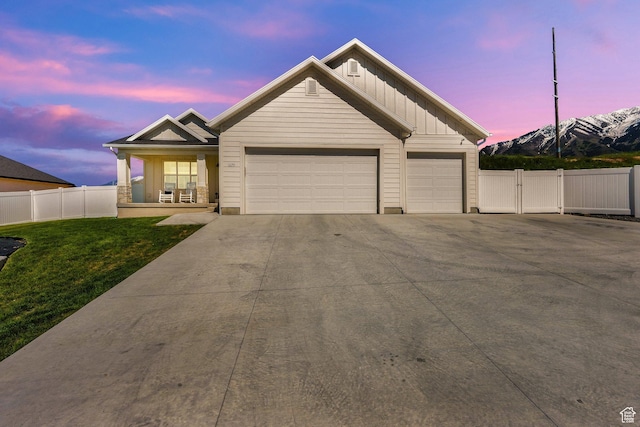 1279 S 50 E, Salem, UT 84653 - view of front of property with board and batten siding, a garage, driveway, and a porch