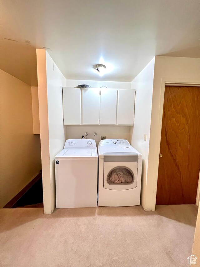 310 S 100 W, Monroe, UT 84754 - laundry room featuring cabinet space, light carpet, and separate washer and dryer
