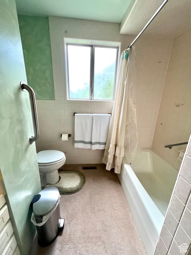 310 S 100 W, Monroe, UT 84754 - bathroom featuring shower / bathtub combination with curtain, tile walls, and toilet