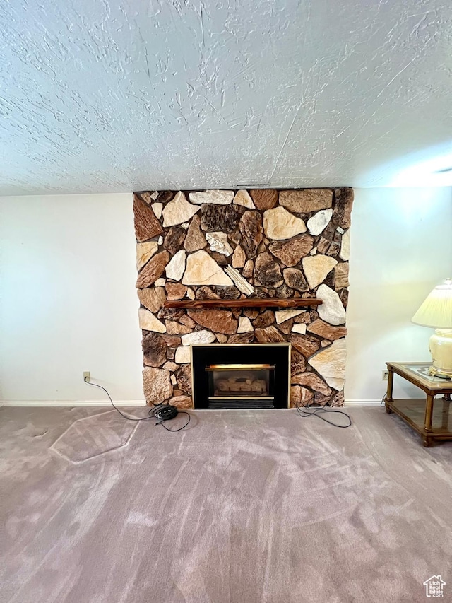 310 S 100 W, Monroe, UT 84754 - detailed view of baseboards, a stone fireplace, a textured ceiling, and carpet