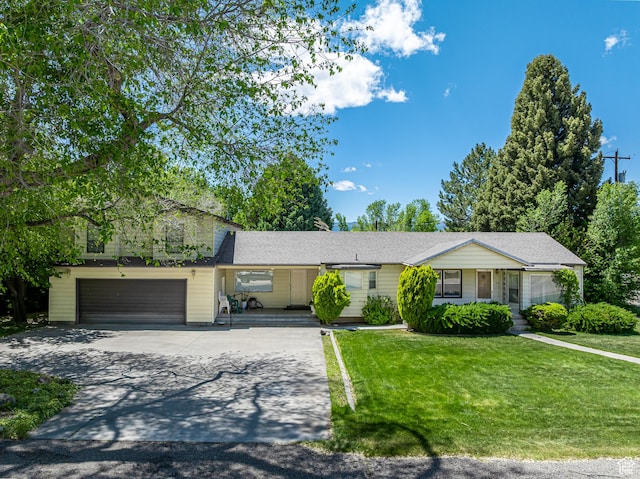 310 S 100 W, Monroe, UT 84754 - view of front of house with driveway, a front lawn, a porch, and an attached garage
