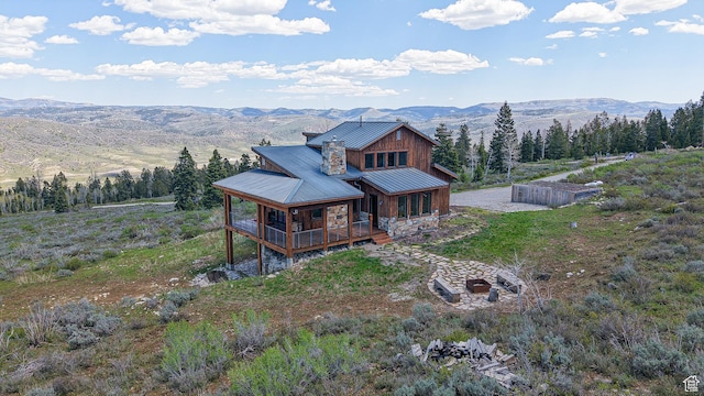 22677 E Snowbird Dr Unit 47, Spanish Fork, UT 84660 - view of front of home with a mountain view, metal roof, board and batten siding, a standing seam roof, and a porch