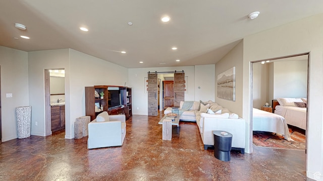 22677 E Snowbird Dr Unit 47, Spanish Fork, UT 84660 - living room with a barn door, finished concrete flooring, and recessed lighting