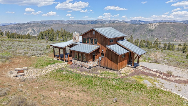 22677 E Snowbird Dr Unit 47, Spanish Fork, UT 84660 - view of front of house featuring metal roof, a mountain view, a standing seam roof, a chimney, and board and batten siding
