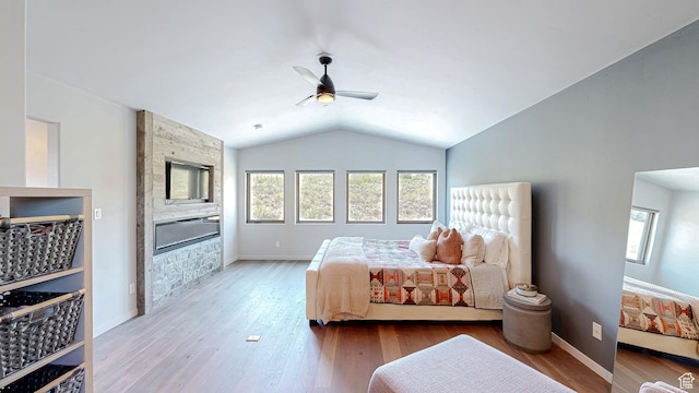 22677 E Snowbird Dr Unit 47, Spanish Fork, UT 84660 - bedroom featuring multiple windows, a stone fireplace, lofted ceiling, wood finished floors, and ceiling fan