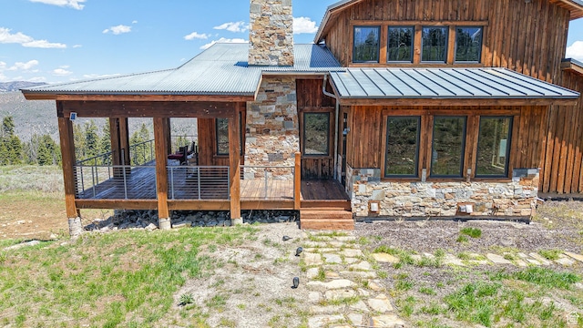 22677 E Snowbird Dr Unit 47, Spanish Fork, UT 84660 - view of front facade with stone siding, a chimney, metal roof, and board and batten siding