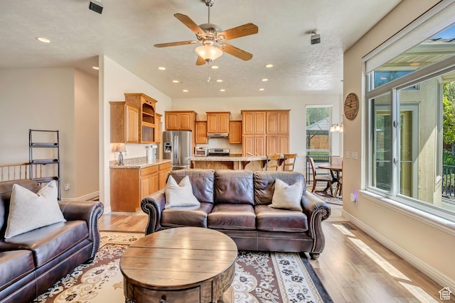 1804 E Longbranch Ct, Draper Ut Cnty, UT 84020 - living room featuring light wood-style flooring, baseboards, ceiling fan, and recessed lighting