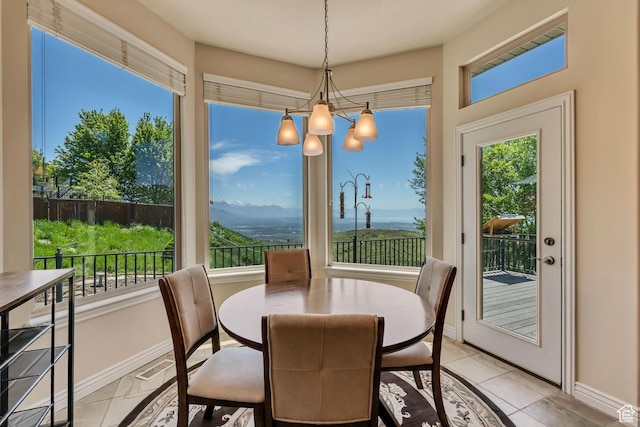 1804 E Longbranch Ct, Draper Ut Cnty, UT 84020 - dining space featuring plenty of natural light, baseboards, light tile patterned floors, and a chandelier