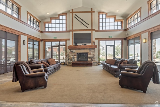1804 E Longbranch Ct, Draper Ut Cnty, UT 84020 - living room featuring high vaulted ceiling, a stone fireplace, and recessed lighting