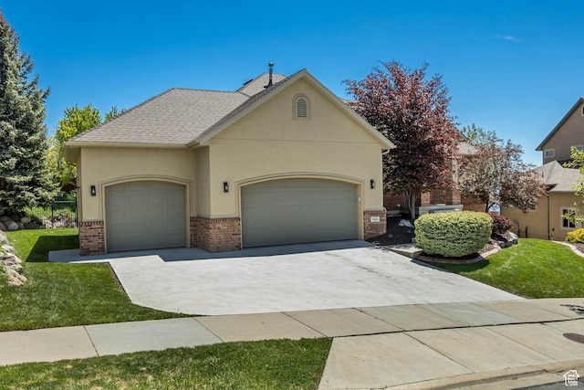 1804 E Longbranch Ct, Draper Ut Cnty, UT 84020 - view of front of property with brick siding, an attached garage, driveway, and a front lawn