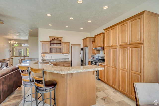 1804 E Longbranch Ct, Draper Ut Cnty, UT 84020 - kitchen featuring appliances with stainless steel finishes, open shelves, under cabinet range hood, recessed lighting, and a breakfast bar area