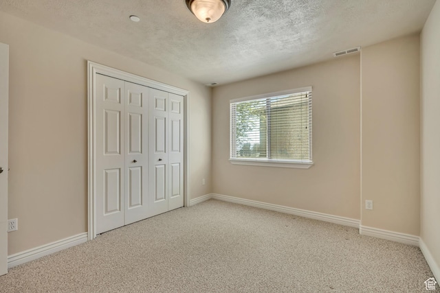 1804 E Longbranch Ct, Draper Ut Cnty, UT 84020 - unfurnished bedroom with carpet floors, a closet, a textured ceiling, and baseboards