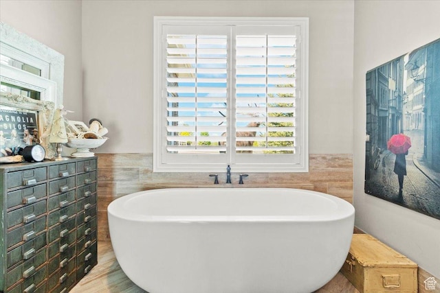 1079 S 400 E, Nephi, UT 84648 - full bath with a soaking tub, tile walls, and a wainscoted wall