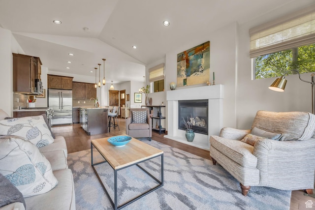 1009 W White Cloud Trl, Kamas, UT 84036 - living room with lofted ceiling, wood finished floors, recessed lighting, and a glass covered fireplace