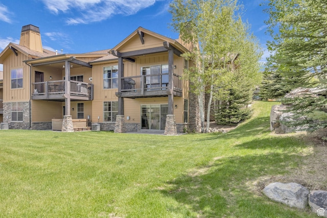 1009 W White Cloud Trl, Kamas, UT 84036 - back of house with stone siding, a chimney, and a balcony