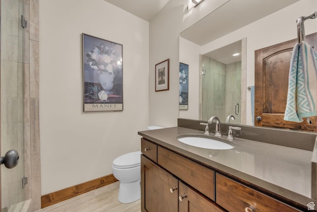 1009 W White Cloud Trl, Kamas, UT 84036 - bathroom with vanity, a shower stall, toilet, baseboards, and wood finished floors