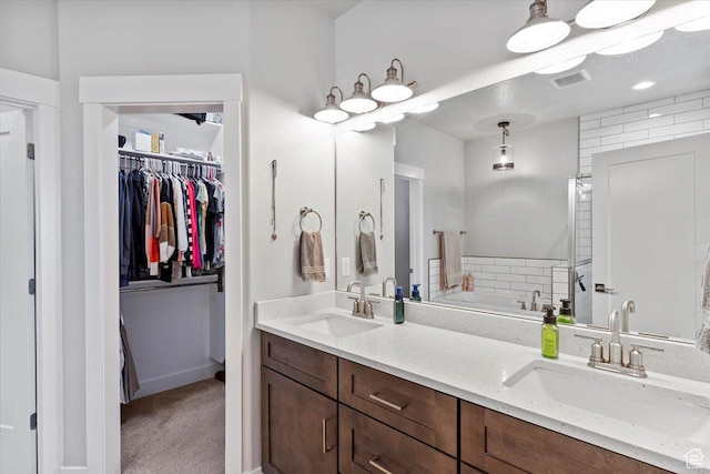 1243 Kotter Dr, Brigham City, UT 84302 - full bath with double vanity, a garden tub, and a walk in closet