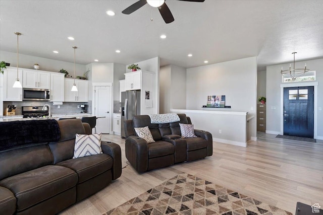 1243 Kotter Dr, Brigham City, UT 84302 - living room featuring ceiling fan, light wood-style floors, recessed lighting, and baseboards