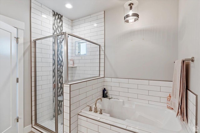 1243 Kotter Dr, Brigham City, UT 84302 - bathroom featuring a shower stall, a bath, and recessed lighting