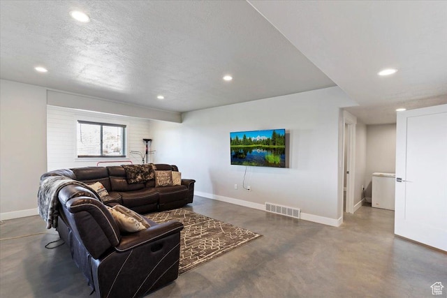 1243 Kotter Dr, Brigham City, UT 84302 - living area with finished concrete floors, recessed lighting, baseboards, and a textured ceiling
