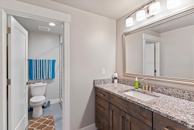 1243 Kotter Dr, Brigham City, UT 84302 - bathroom featuring baseboards, toilet, and vanity
