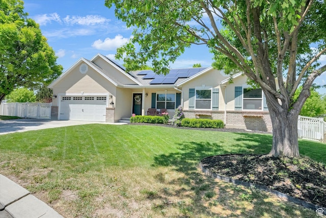 42 E Frontier Ct, Saratoga Springs, UT 84045 - ranch-style home with brick siding, roof mounted solar panels, an attached garage, concrete driveway, and stucco siding