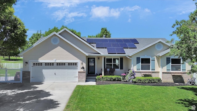 42 E Frontier Ct, Saratoga Springs, UT 84045 - view of front of property with brick siding, driveway, a garage, and roof mounted solar panels
