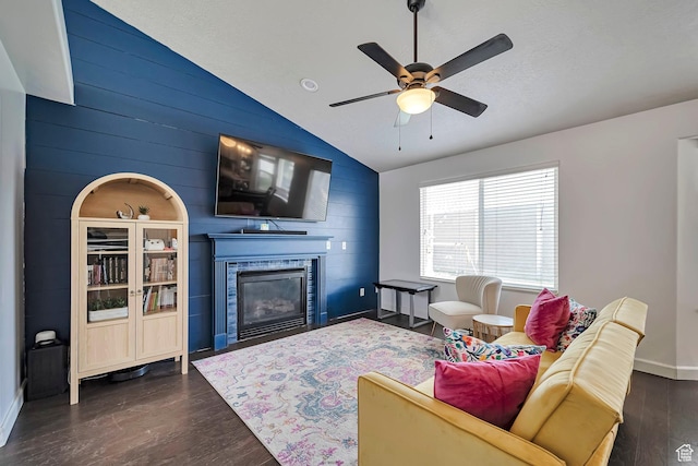 267 W Noah Cir S, Murray, UT 84107 - living room featuring vaulted ceiling, dark wood-type flooring, ceiling fan, a glass covered fireplace, and baseboards