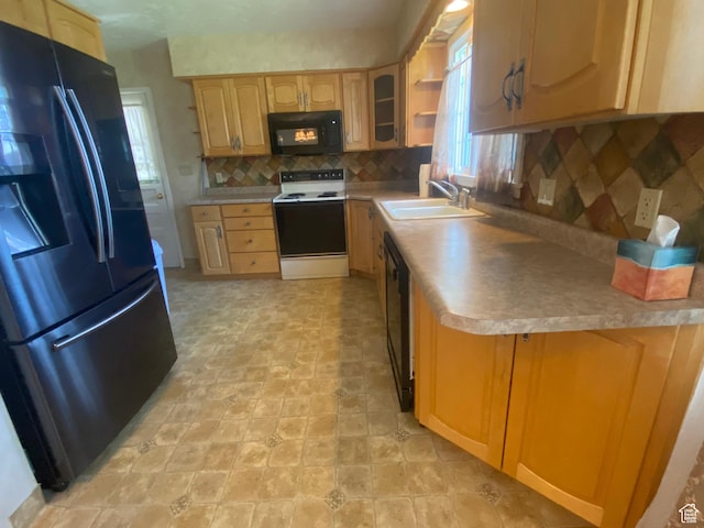 225 S 200 E, Price, UT 84501 - kitchen with black appliances, a sink, decorative backsplash, light countertops, and light brown cabinets