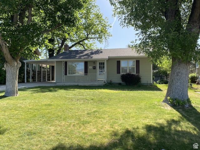 225 S 200 E, Price, UT 84501 - ranch-style home featuring covered porch, a front lawn, and a chimney