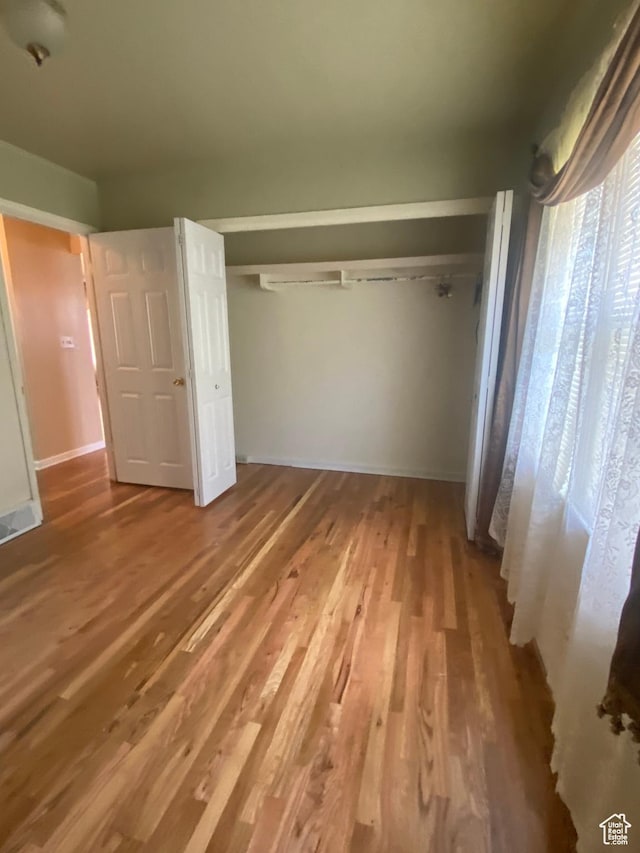 225 S 200 E, Price, UT 84501 - unfurnished bedroom with a closet, wood finished floors, and baseboards