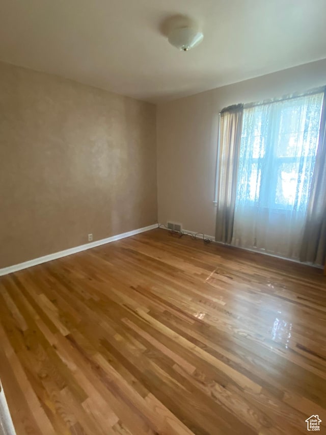 225 S 200 E, Price, UT 84501 - spare room featuring wood finished floors and baseboards
