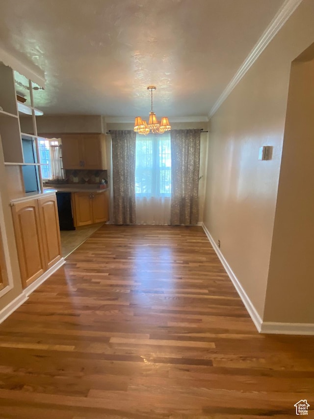 225 S 200 E, Price, UT 84501 - unfurnished dining area featuring a chandelier, light wood finished floors, ornamental molding, and baseboards