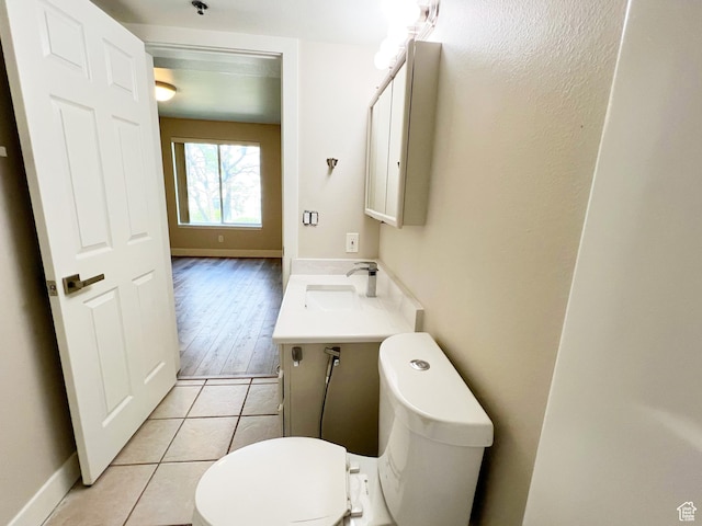 543 S 900 E Unit C3, Salt Lake City, UT 84102 - half bath with toilet, vanity, tile patterned floors, and baseboards