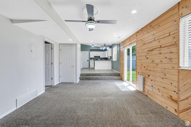 2033 W 410 S, Provo, UT 84601 - unfurnished living room with light colored carpet, a ceiling fan, wood walls, baseboards, and electric panel
