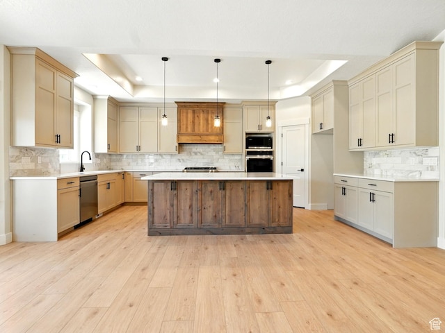 2023 S 150 W, Perry, UT 84302 - kitchen featuring appliances with stainless steel finishes, a raised ceiling, decorative backsplash, light wood-style flooring, and recessed lighting