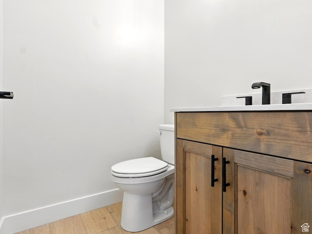 2023 S 150 W, Perry, UT 84302 - half bath featuring vanity, toilet, baseboards, and wood finished floors