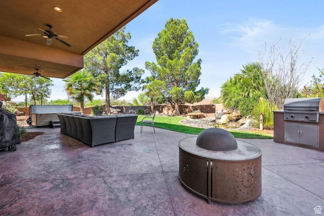 2090 N Tuweap Dr Unit 9, St George, UT 84770 - fenced backyard with area for grilling, a patio area, an outdoor living space with a fire pit, and a ceiling fan