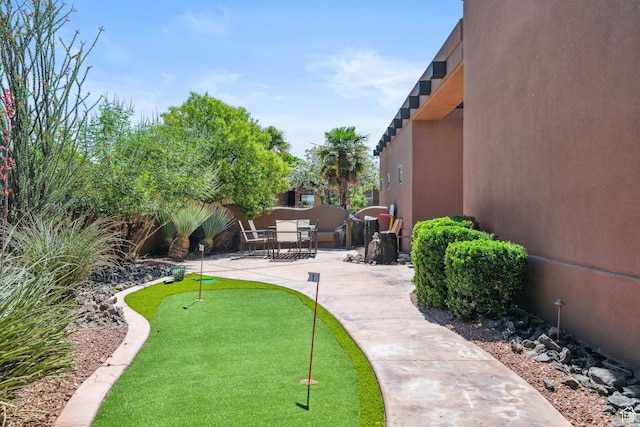2090 N Tuweap Dr Unit 9, St George, UT 84770 - view of property's community featuring a putting area and a patio area