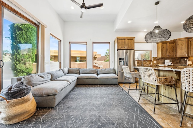 2090 N Tuweap Dr Unit 9, St George, UT 84770 - living room with plenty of natural light, dark tile patterned flooring, and recessed lighting