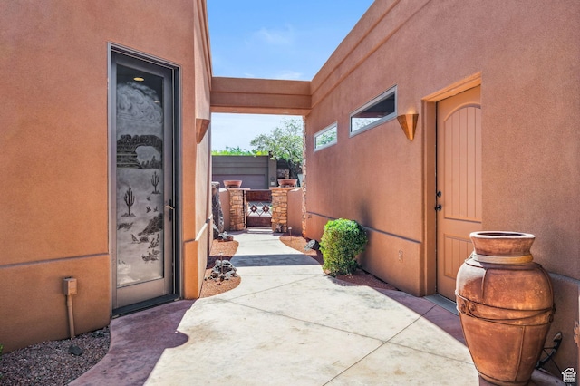 2090 N Tuweap Dr Unit 9, St George, UT 84770 - doorway to property with stucco siding, a gate, and a patio