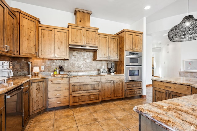 2090 N Tuweap Dr Unit 9, St George, UT 84770 - kitchen with stainless steel double oven, light tile patterned floors, tasteful backsplash, hanging light fixtures, and light stone counters