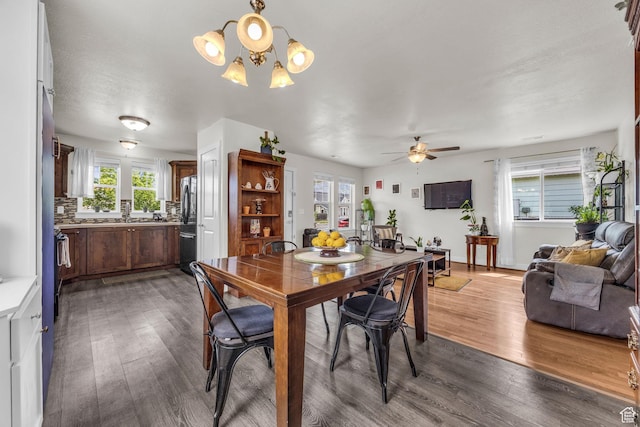 161 E 27th St S, Ogden, UT 84401 - dining area featuring healthy amount of natural light, wood finished floors, and a chandelier
