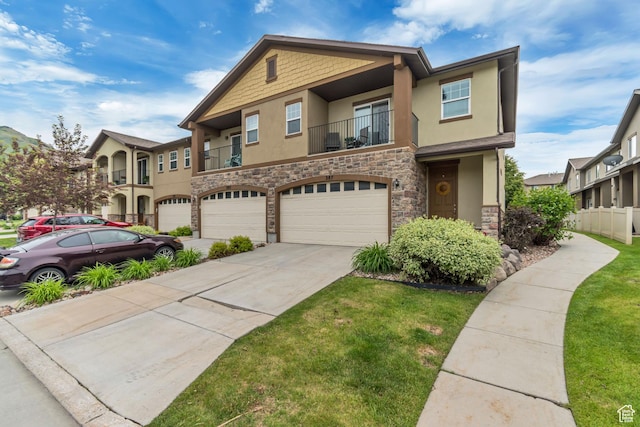287 W 680 N, Centerville, UT 84014 - multi unit property with stucco siding, stone siding, a garage, concrete driveway, and a balcony
