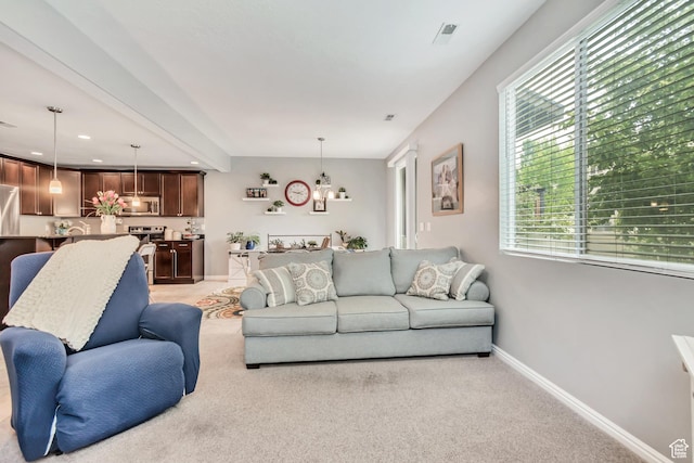 287 W 680 N, Centerville, UT 84014 - living area with light carpet, healthy amount of natural light, baseboards, a chandelier, and recessed lighting