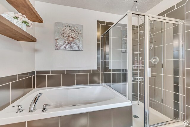 287 W 680 N, Centerville, UT 84014 - bathroom featuring a garden tub and a stall shower