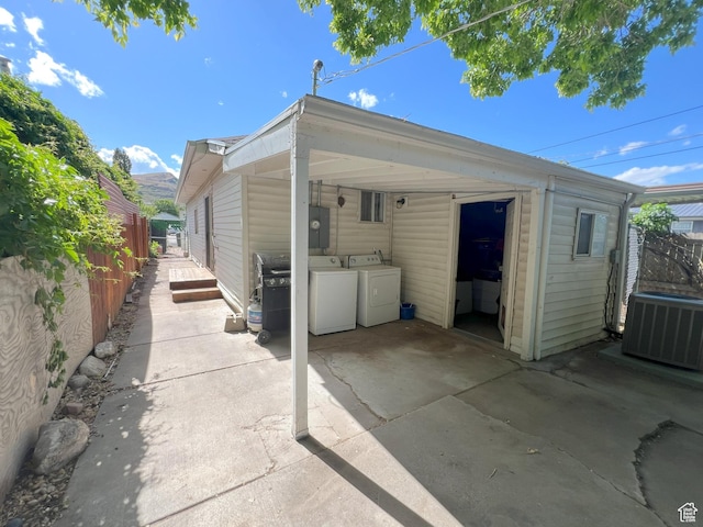 2849 S 8950 W, Magna, UT 84044 - rear view of property with central AC unit, separate washer and dryer, a fenced backyard, and a patio area