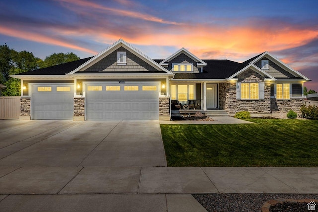 3498 W Harvestwood Ln S, Riverton, UT 84065 - craftsman inspired home with stone siding, a front yard, a garage, driveway, and covered porch