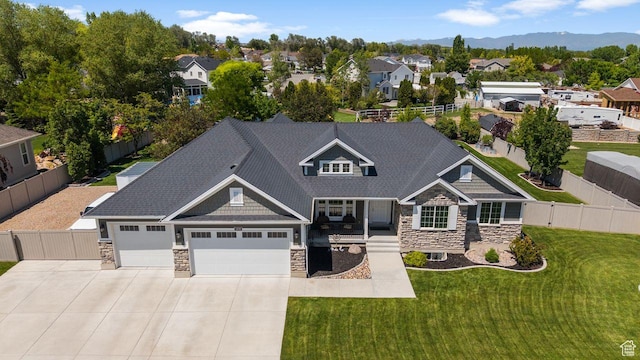 3498 W Harvestwood Ln S, Riverton, UT 84065 - view of front of property with stone siding, driveway, an attached garage, and a residential view